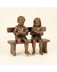Boy And Girl Reading Books On Bench Bronze Statue - Size : 48 '' L X 29 '' W X 39 '' H . (synthetic illustration; no displayed measurements)