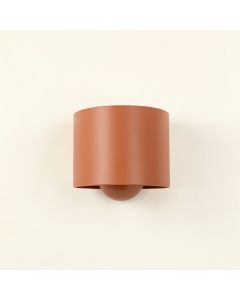 Juniper Bend Wall Sconce Mounted On A Plain Wall - Terracotta (synthetic illustration; no displayed measurements)