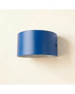 Juniper Crest Wall Sconce Mounted On A Plain Wall - Blue (synthetic illustration; no displayed measurements)