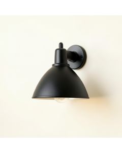 Linden Bend Wall Sconce Mounted On A Plain Wall - Black (synthetic illustration; no displayed measurements)